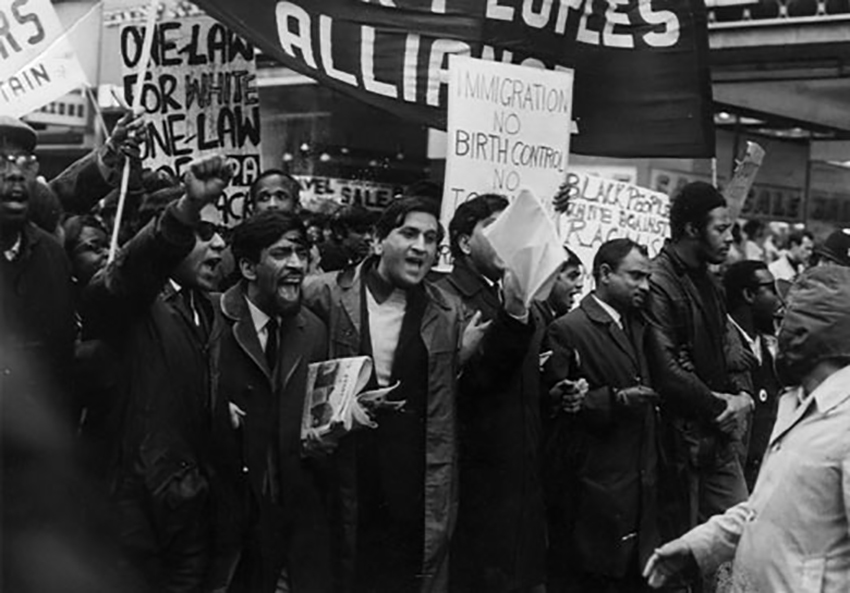 Old image showing a march.